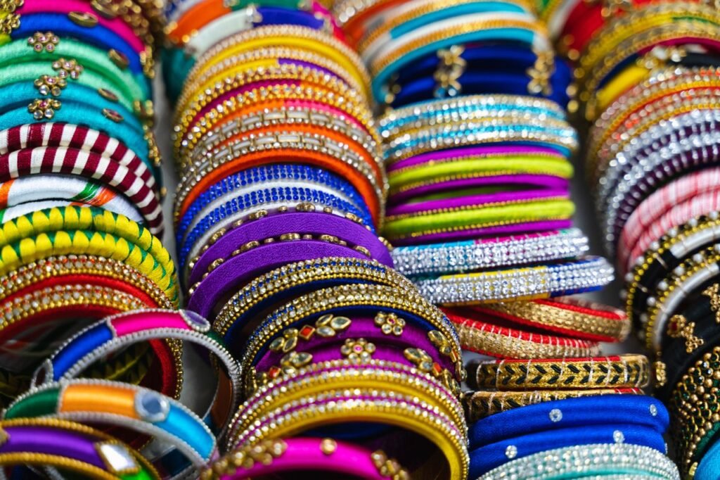 Menu A display of colorful and vibrant bangles showcasing intricate designs and materials.