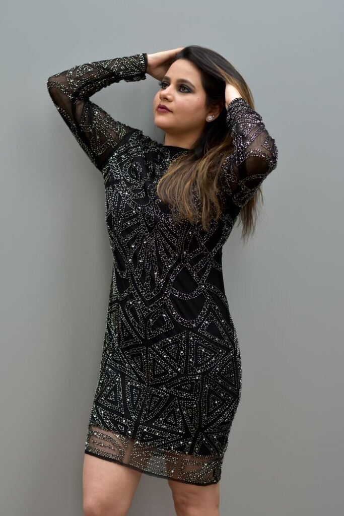Crafting Captivating Headlines: Your awesome post title goes here Fashion model posing elegantly in a sparkling dress, showcasing beauty and style.