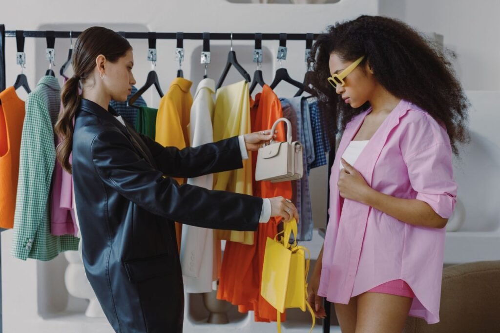 About Two women shopping and exploring trendy fashion in a boutique setting.